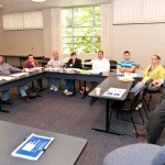 Roger Kipp, vice president of marketing and engineering for McClarin Plastics Inc. (leaning on desk), offers a presentation on mold construction in the Part and Tool Design Lab. Roger Kipp, vice president of marketing and engineering for McClarin Plastics Inc. (leaning on desk), offers a presentation on mold construction in the Part and Tool Design Lab.