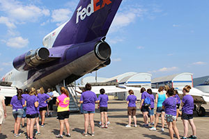 Participants in SMART Girls at Pennsylvania College of Technology prepare to explore a retired FedEx Boeing 727 now used for instructional purposes at the college’s Lumley Aviation Center.