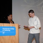 The speaker accepts a commemorative plaque from Malinda C. Love, assistant director of student activities for diversity and cultural life (and the organizer of the David London My Last Words Lecture Series).