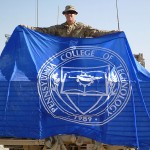 Sgt. Peter J. Cassarly displays college flag.