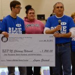 Robert M. Fischer gathers at midcourt with his wife, Mary Ann (left), and son, Zack (center), along with representative members of their "extended family" at Penn College. Robert M. Fischer gathers at midcourt with his wife, Mary Ann (left), and son, Zack (center), along with representative members of their "extended family" at Penn College.