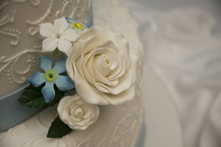 Gum-paste roses offset piping design.