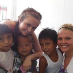 Kristan S. Delbo (left) and Kathrine E. Dixon, with children during a study-abroad trip to Nicaragua over Spring Break.
