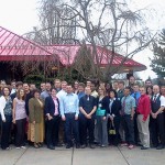 Dining room manager Ameila A. Seaton (at far right) and her staff gather with students and their mentors outside Le Jeune Chef.