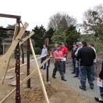 Brian Trader, coordinator of domestic and international studies, shows Horticulture Club members a student-built "work in progress" at Longwood Gardens.