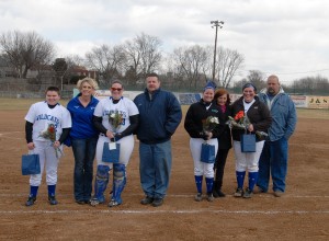 This season's softball seniors gather with family members along the first-base line at Elm Park for recognition Tuesday. Graduating players, from left, are Lindsey R. Anderson, Britni M. Fennell, Stephanie N. Keifrider and Lacy M. Lose.
