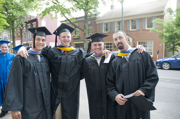 Building automation grads play it cool as they await the procession.