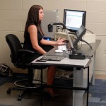 Kathleen K. Hart, of Binghamton, N.Y., explains the site she designed for Gilmour Arts – and rebuilt from backup files when it was hacked shortly before her presentation.