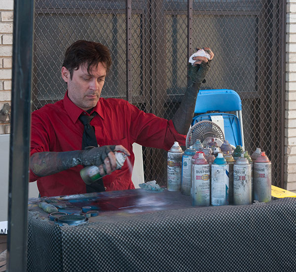 Always a treat to watch, a spray-paint artist works his magic.