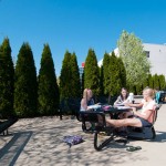Plenty of blue sky and seasonal greenery: a pleasant backdrop for finals prep on the library patio. Plenty of blue sky and seasonal greenery: a pleasant backdrop for finals prep on the library patio.