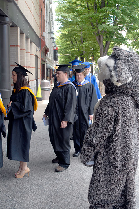 Friday's procession is blessed by sunshine – and a visit from the college mascot.