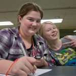 Curtin students track the time it takes their team to recreate a Lego model from memory.