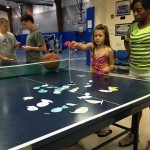 A pingpong table doubles as a well-stocked "fishin' hole."