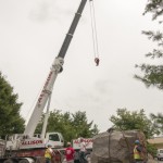 Allison employees prepare to hook the boulder to the crane.