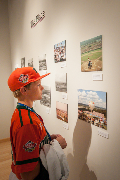 A Series participant views photos of the Little League