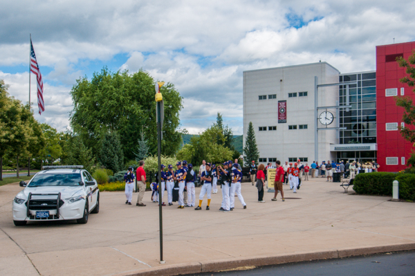 Teams disembark outside Madigan Library, where they are greeted by student/staff ambassadors.
