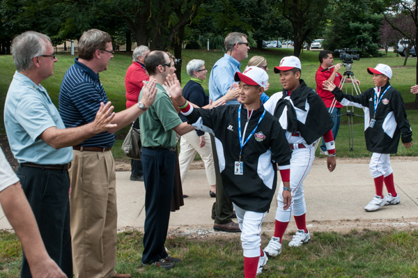 Members of President's Council, gathered west of the Campus Center, add a personal touch to the afternoon festivities.