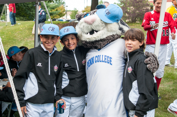 A fun photo op with Caribbean players allows the Wildcat to say,