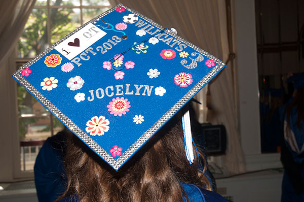 Jocelyn E. Moyer’s cap reflects her love for Wildcat soccer and occupational therapy assistants.