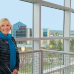 Carol Savoy, a 1973 graduate, recalls trolley tracks and dirt parking lots during her student days. She is president of Savoy Contract Furniture, the company her late husband, John, established.