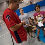 Logan Pierce personalizes a young fan's bat ...