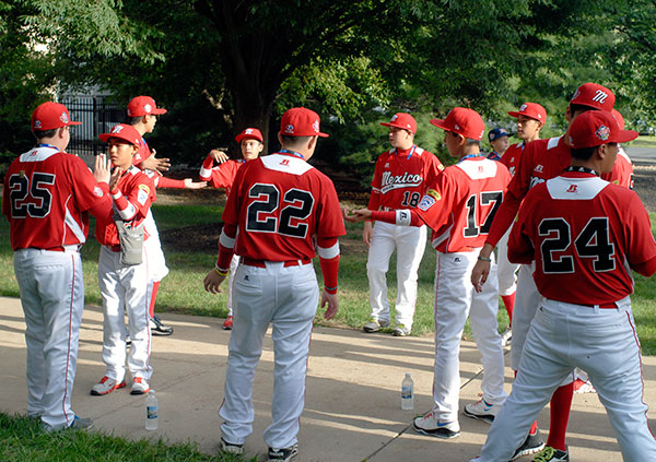 The Mexico team (from Tijuana, Baja California) passes the time with a fast-paced elimination contest involving syncopated hand-clapping.
