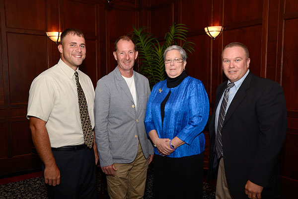 Alumni honoree Ronald A. Burger, second from left, joins (from left) Jeremy L. Thorne, a May graduate in ornamental horticulture who nominated him for the mentorship award; President Gilmour; and Carl J. Bower Jr., a horticulture instructor in the college's School of Transportation and Natural Resources Technologies.