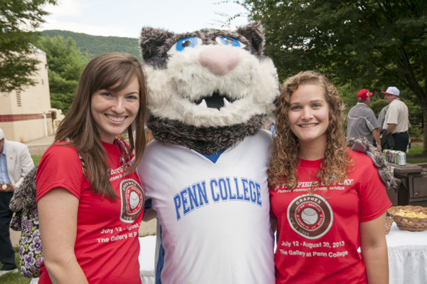 Kelly M. Daum and Kacey S. Ammerman, a nursing student, take a shot with the Wildcat.