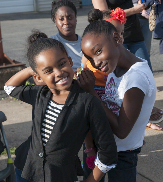 Parade-goers pose for the photography-themed float.