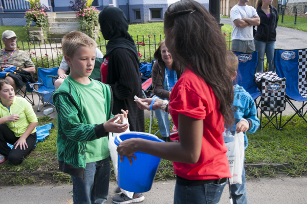 Yazmin E. Strauss hands out trading pins.