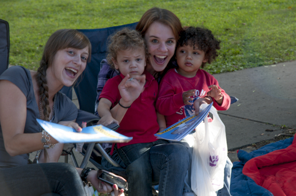 Parade-goers express their thanks for “What Does the Wildcat Want to Be When It Grows Up?” coloring books.