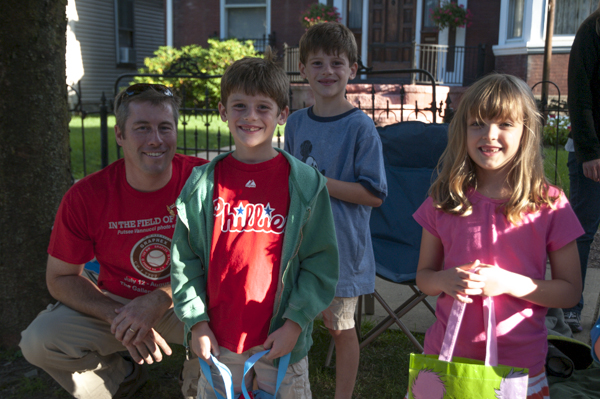 Members of the Rob Cooley (assistant professor of anthropology/environmental science) and David S. Richards (professor of physics) families enjoy the parade together.