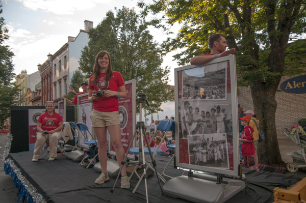 With vintage camera equipment in hand, students April M. Tucker, an applied human services student, and Kelly M. Daum, majoring in applied health studies: occupational therapy assistant concentration, help promote The Gallery at Penn College’s Little League photo exhibit.