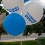 Balloons bob and bounce in the day's gentle breeze outside the ACC.