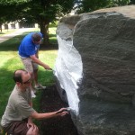 Bradley M. Webb, director of student affairs administration (foreground), and Elliott Strickland, chief student affairs officer, aid the cause – brush stroke by painstaking brush stroke. (Photo by Joe Miller, manager of audio/visual services)