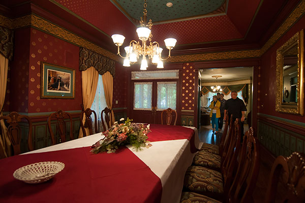 Guests tour the spacious and gorgeously furnished dining room in the student-built showpiece.