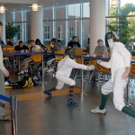 Edward Ploy Jr., from the Williamsport Fencing Club, explains a display of swordsmanship by members Leo Bell (left) and Quinn Hartung. Edward Ploy Jr., from the Williamsport Fencing Club, explains a display of swordsmanship by members Leo Bell (left) and Quinn Hartung.