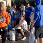Intramural assistant Wyatt J. Decker, a business administration: marketing concentration major from Dushore, wrings out a shirt after the preliminary soak. Intramural assistant Wyatt J. Decker, a business administration: marketing concentration major from Dushore, wrings out a shirt after the preliminary soak.