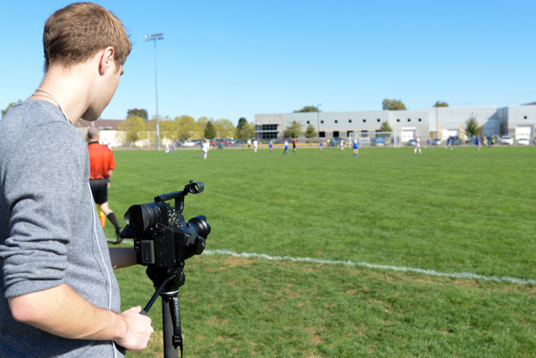 Capturing all the action is Christopher J. Goodwin, a junior in web and interactive media, from Jericho, Vt., and a student video production assistant with College Information & Community Relations. 