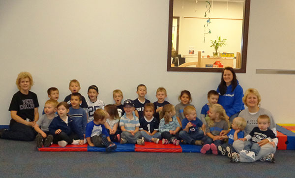 Youngsters and staff at the Dunham Children's Learning Center show off their Wildcat Pride, donning Penn College gear in a group display of spirit.