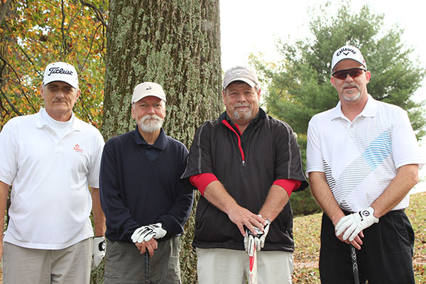 Comprising an august foursome are, from left, Richard L. Manny, a General Services retiree; Thomas A. Zimmerman, associate professor of psychology; Marc E. Bridgens, dean of construction and design technologies; and Walter V. Gower, assistant professor of aviation.