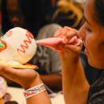 Alyssa J. Morales, a freshman in culinary arts and systems from Reading, gets to work on her creation.