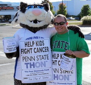 Penn College's Wildcat mascot and Daniel J. Ferretti, a paramedic technician major from Pocono Lake, join the THON fundraising effort last month along Loyalsock Township's Golden Strip.