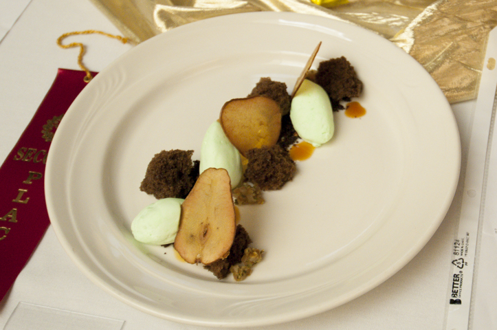 A chocolate, pistachio and pear dessert, made by Lewis D. Robinson, earns second place in the Classical and Specialty Dessert Presentation course.