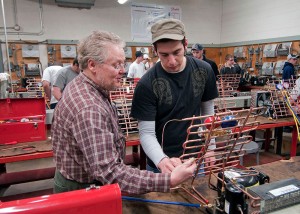 Bruce A. Emig works with a student in this 2010 photo.