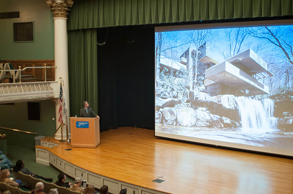The speaker discusses Wright's Fallingwater, a national historic landmark in southwestern Pennsylvania.