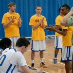 In gold sneakers befitting the evening's theme, Robert F. Beckett III, of Belfast, N.Y., cheers his teammates during starters' introductions. In gold sneakers befitting the evening's theme, Robert F. Beckett III, of Belfast, N.Y., cheers his teammates during starters' introductions.