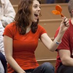 Jessica R. Wiegand, a member of the Off-Campus Housing Organization, enjoys a noise-making giveaway.
