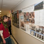 Students' cost-effective and energy-efficient home designs are displayed during a reception in Wrapture.