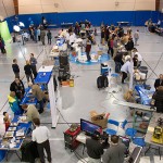 The Field House floor, filled with intriguing family attractions, beckons young scientists. The Field House floor, filled with intriguing family attractions, beckons young scientists.